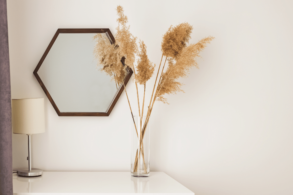 Mirror on the wall reflecting natural light to brighten and decorate your static caravan.