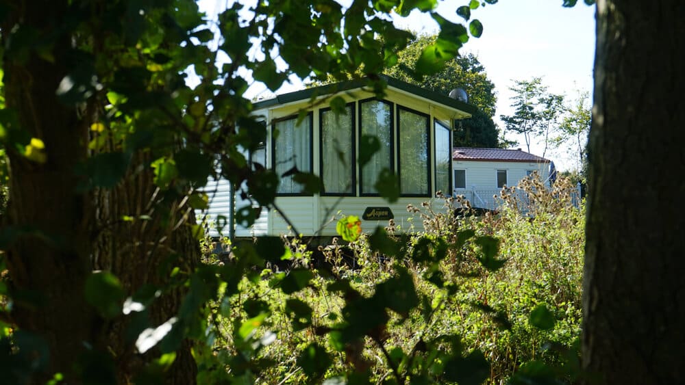 Caravan holiday home at Broadlands Park & Marina with a clear view overlooking the scenic Broads National Park landscape.