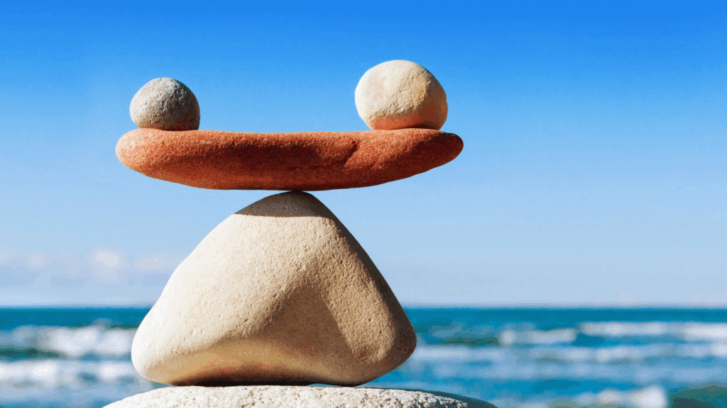 Stacked rocks balancing on each other, symbolising work-life balance and harmony.
