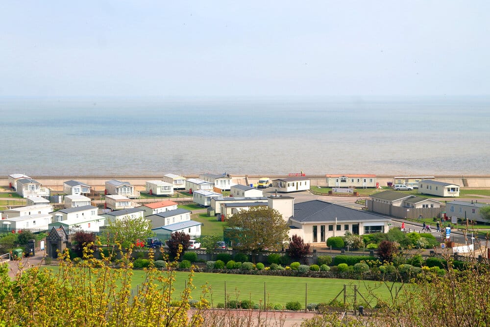 View of North Denes Caravan Park in Lowestoft, Suffolk, with the park and the sea in the background.