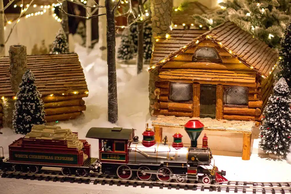 Miniature Christmas train set with festive decorations