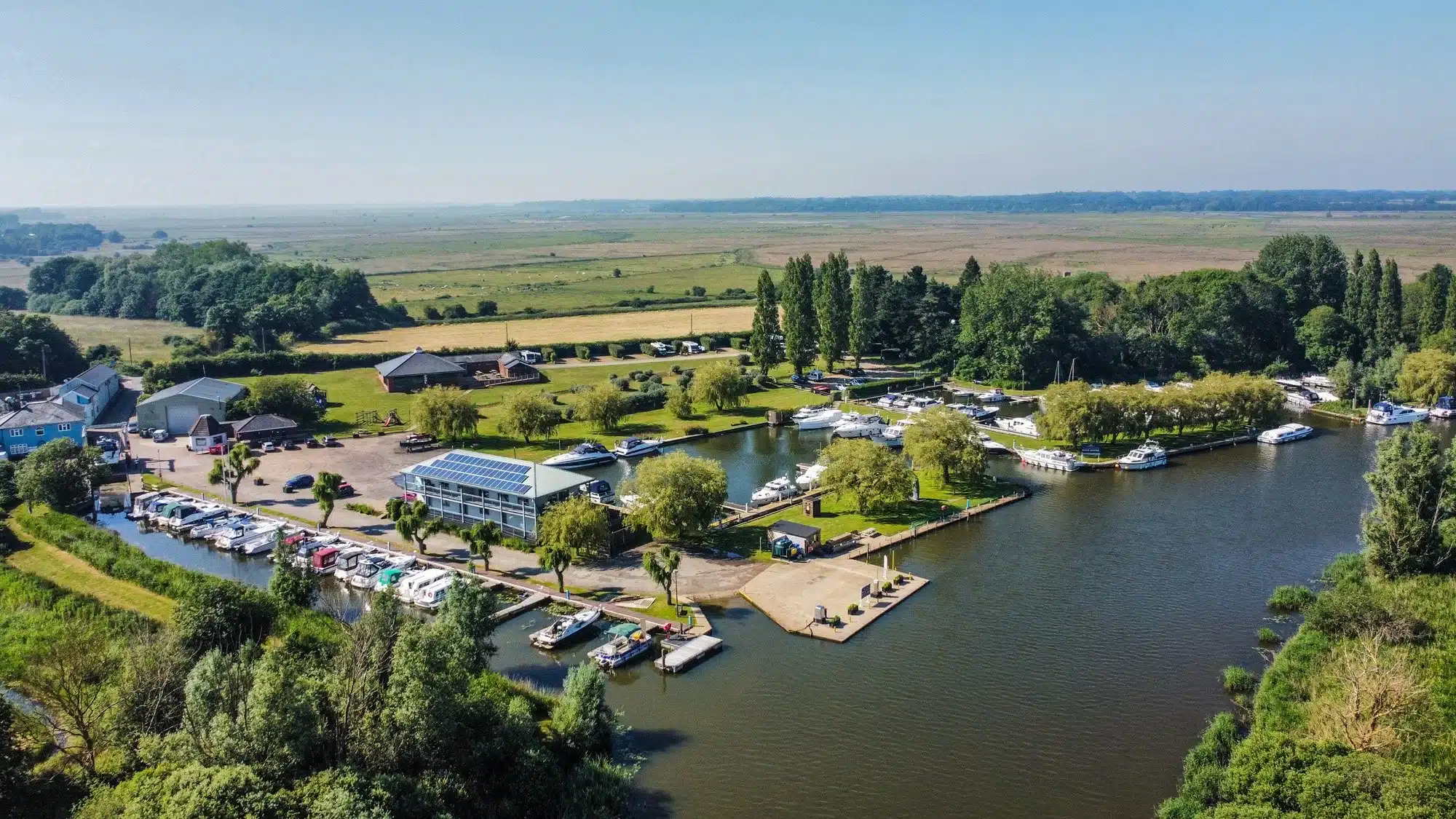 Aerial drone view of Waveney River Centre showing the river, surrounding landscape, and buildings.