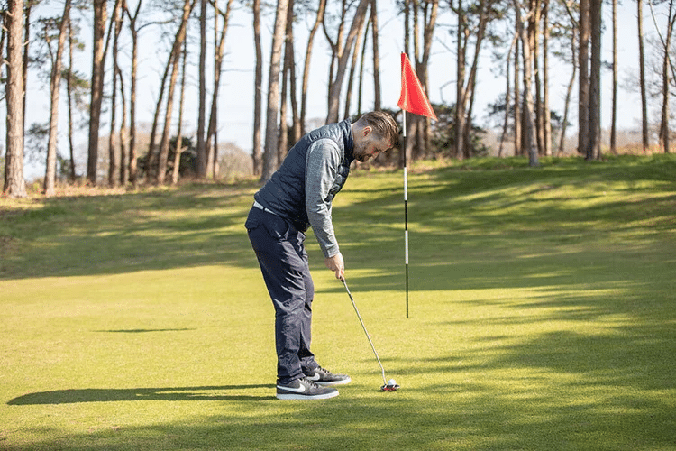 Man playing golf