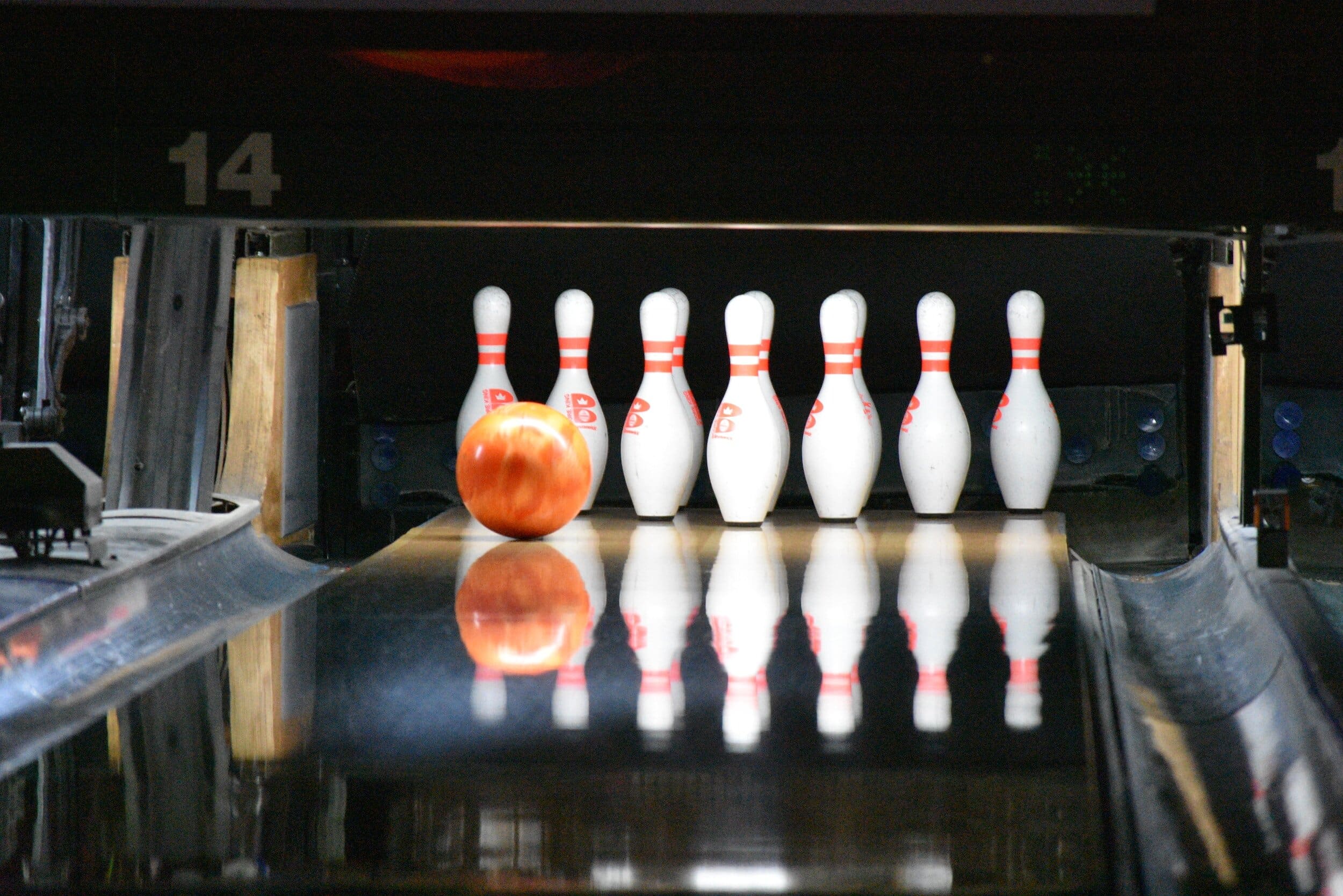 Bowling ball about to hit bowling pins