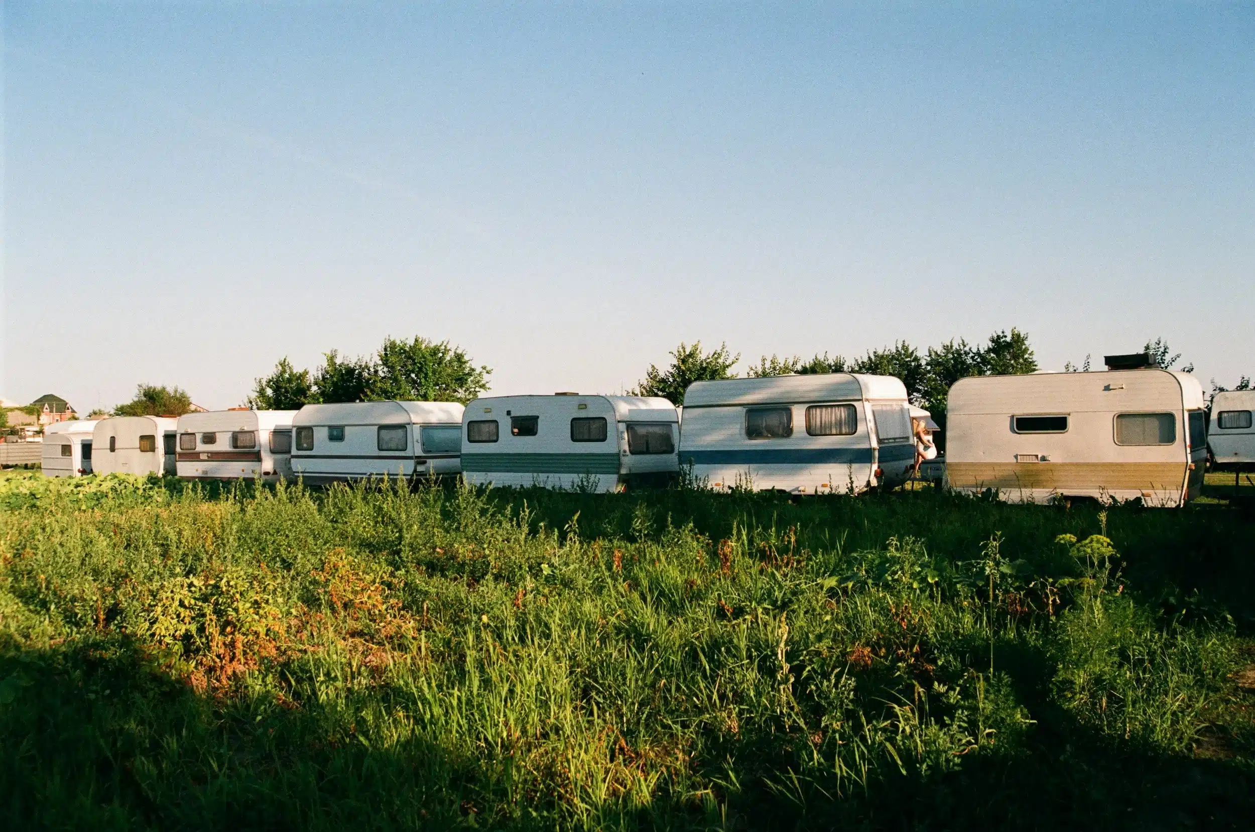 Caravans lined up on a grassy area