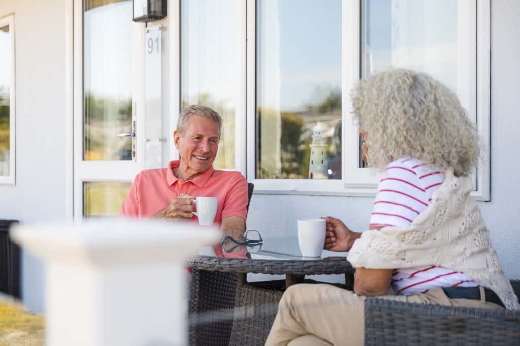 Two people enjoying coffee outdoors.